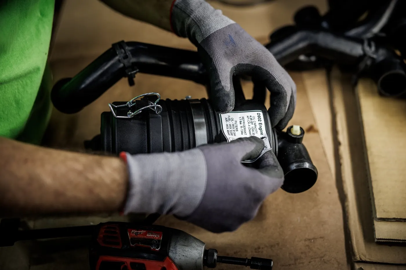 A Green APU technician assembling a unit by hand at the Lemont, Illinois factory