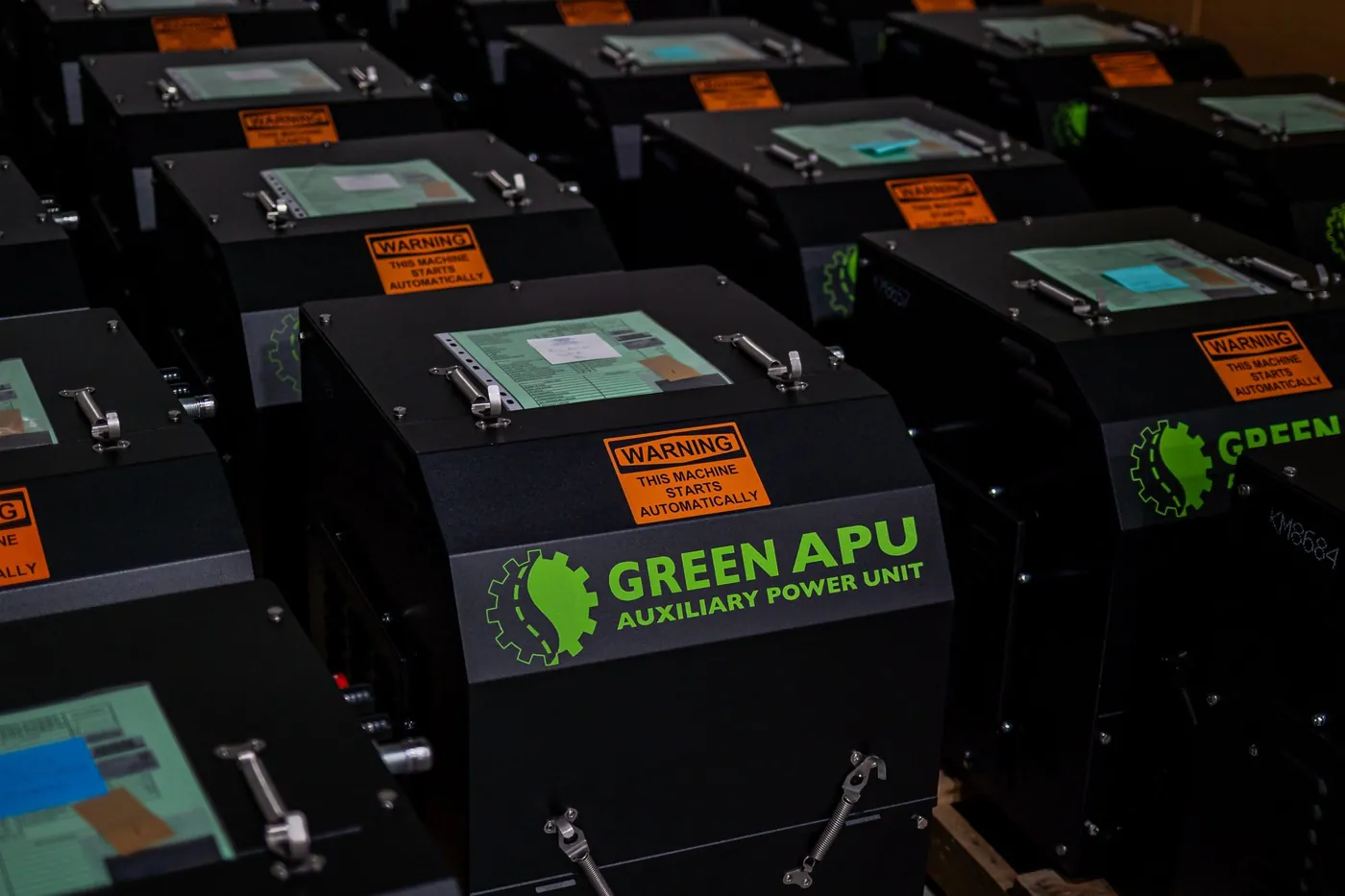 Finished Green APU units racked in rows at the Lemont, Illinois factory